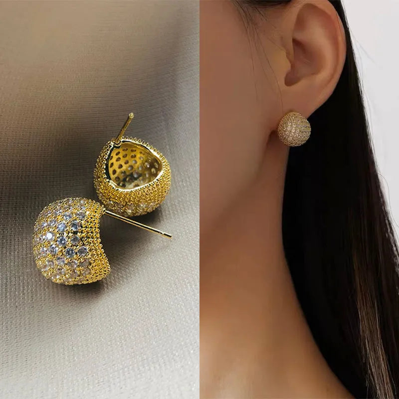 Golden bean earrings with diamond-cut detailing and ear clip fastening in drop shape