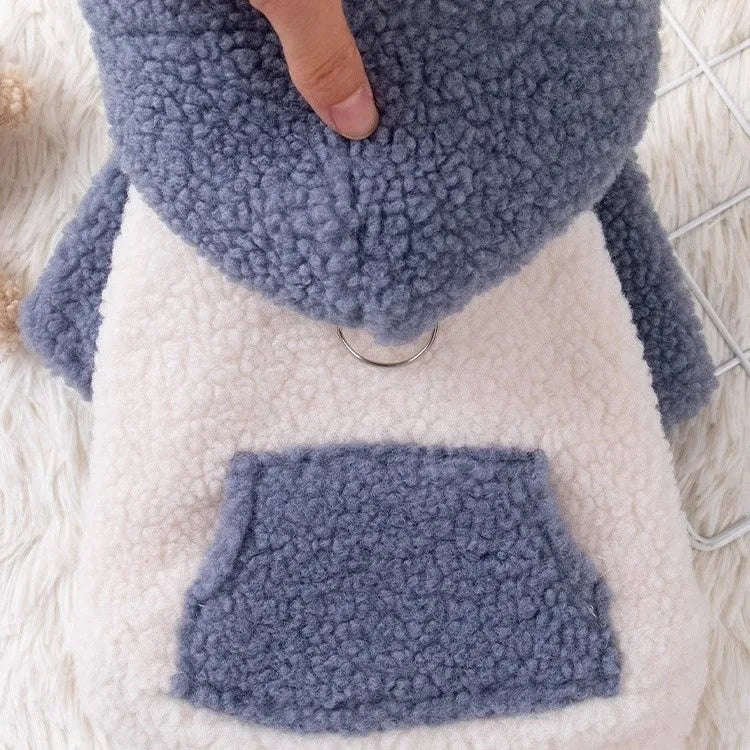 Brown hooded cotton-padded dog coat shown on model, with blue colour option available in sizes XS to XL