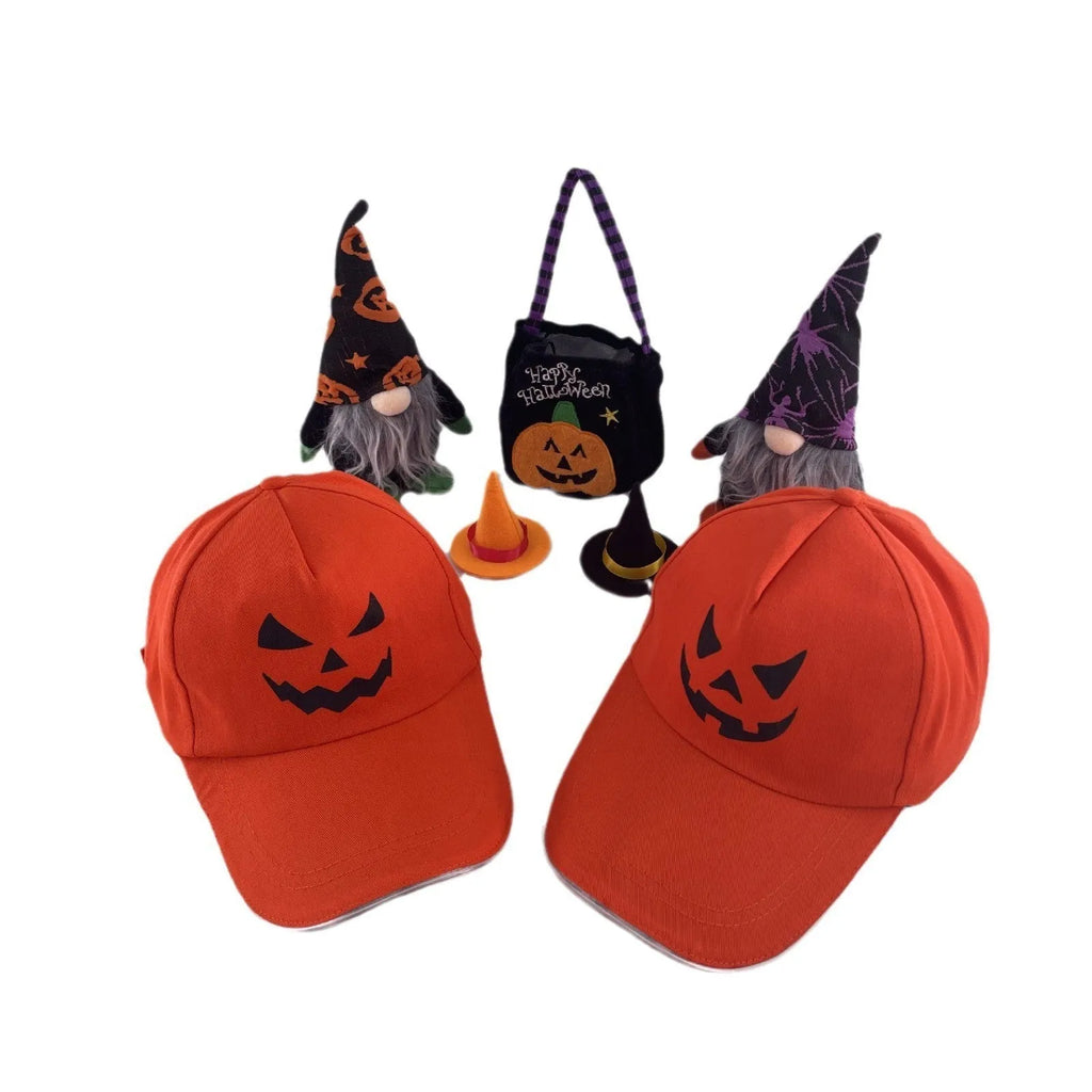 Black Halloween baseball cap with LED pumpkin smile face and yellow lights illuminated.