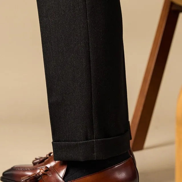 Men's black polished leather tassel loafers with rubber soles for business casual wear