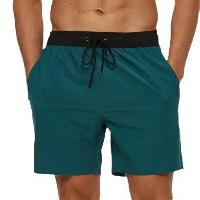 Men's blue running shorts with a stitching waistband, drawstring, and zipper pocket.