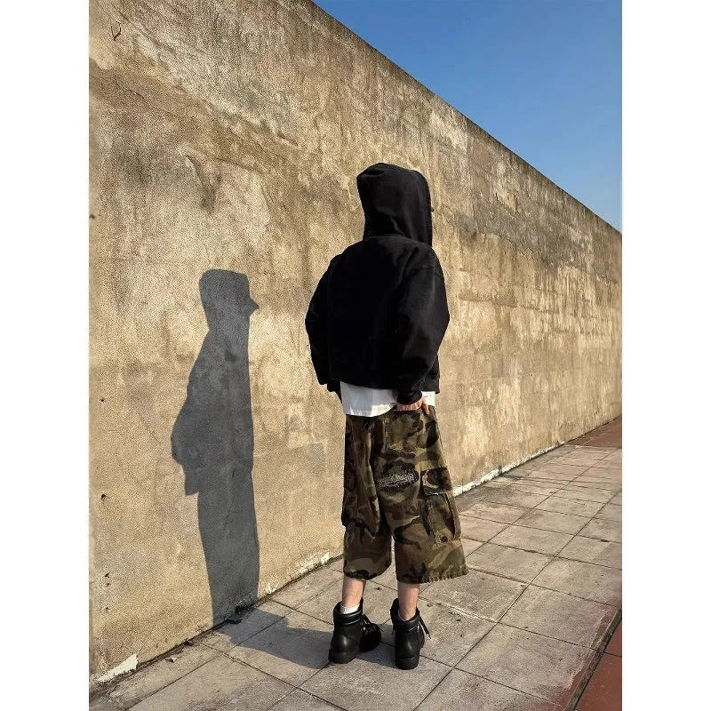 Men's camouflage cropped pants with ripped patches and straight leg cut