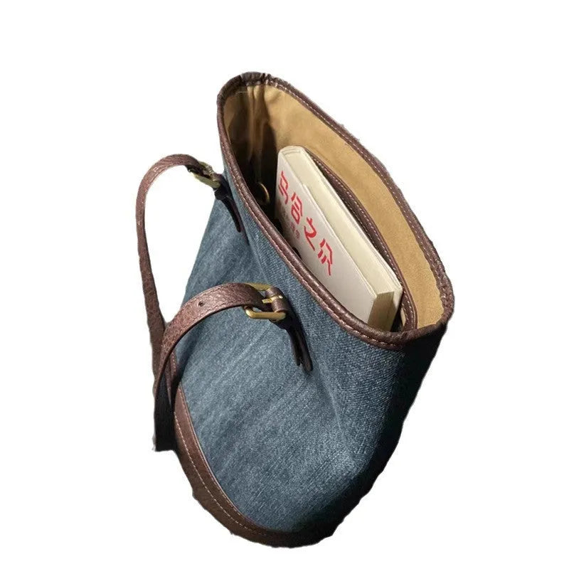 Denim patchwork bucket handbag with one shoulder strap showing retro styling