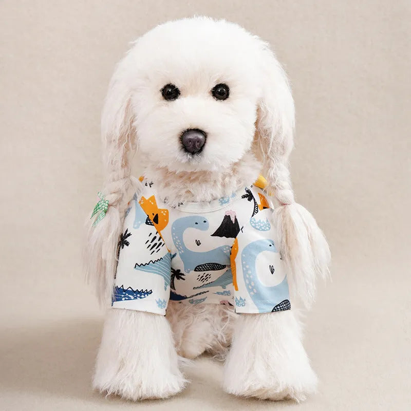 Colourful printed polyester t-shirt on a small dog, showing the casual fit and design.