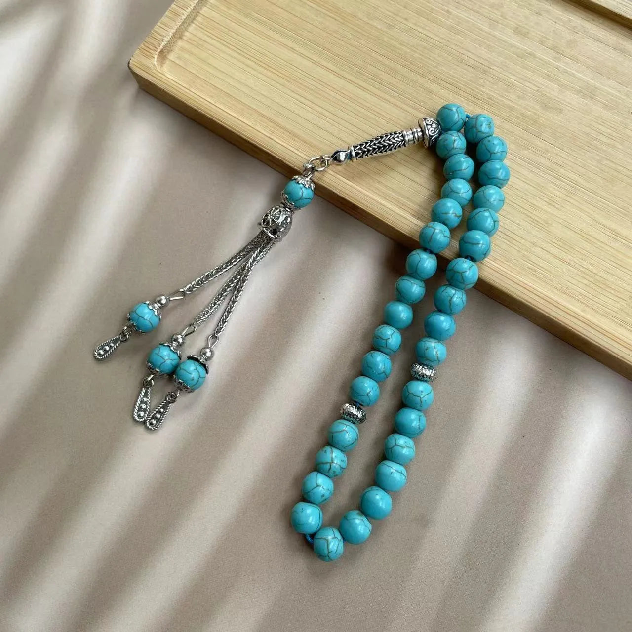 Handmade sky blue stone bead Muslim prayer bracelet for daily worship and dhikr counting.