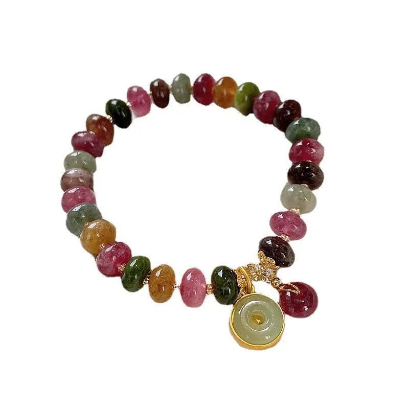 Colourful tourmaline abacus bead bracelet with rabbit pendant charm on wrist