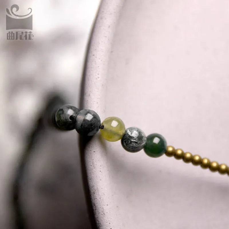 Handcrafted ethnic children's bracelet with natural crystal stones in multi-layered retro design