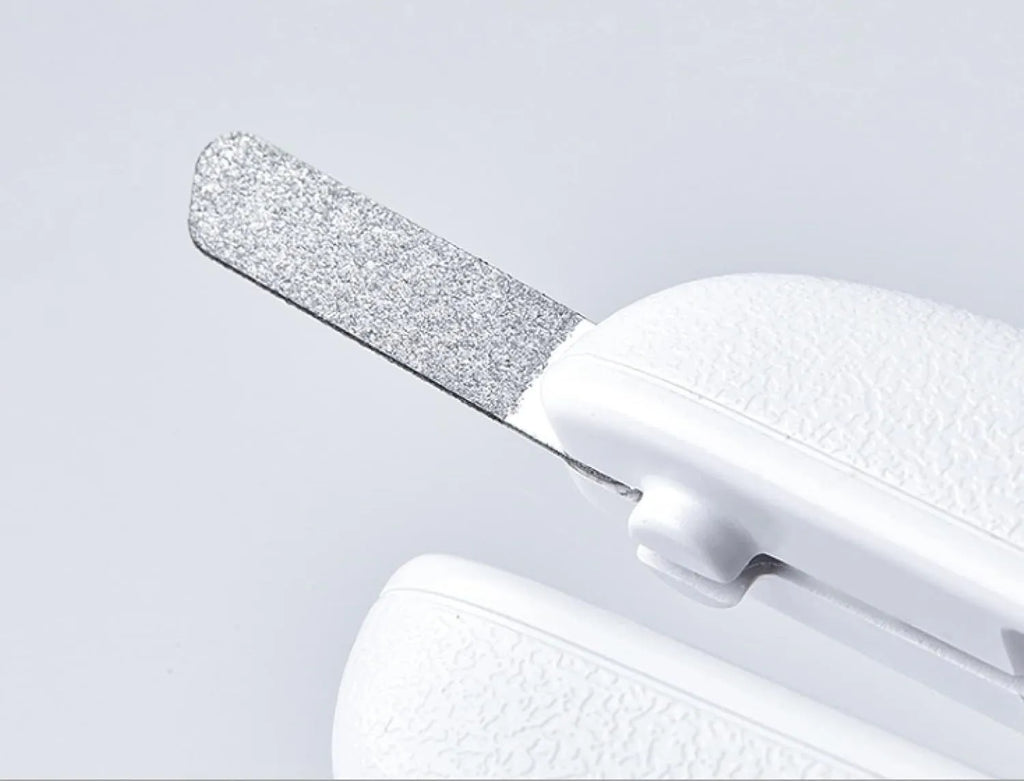 White LED pet nail clippers with a transparent guard open, showing the triangular blade and integrated nail file.