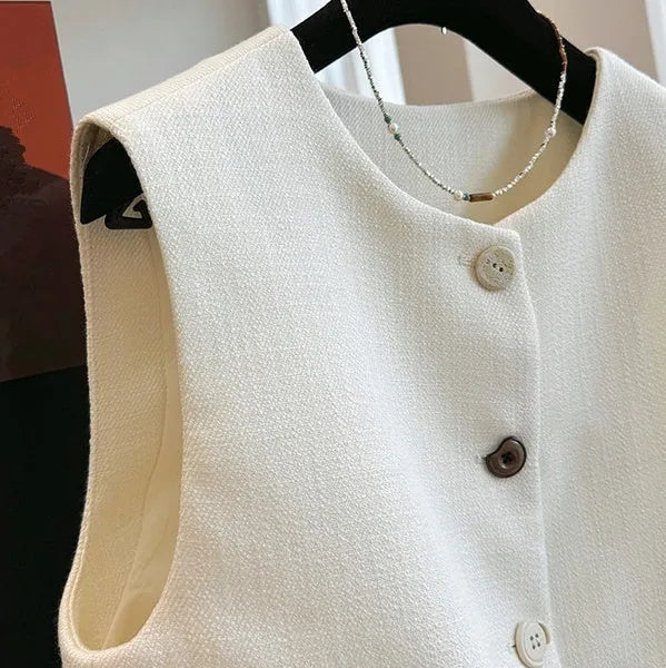 Women's sleeveless polyester bandage vest dress with round neck in milky white.