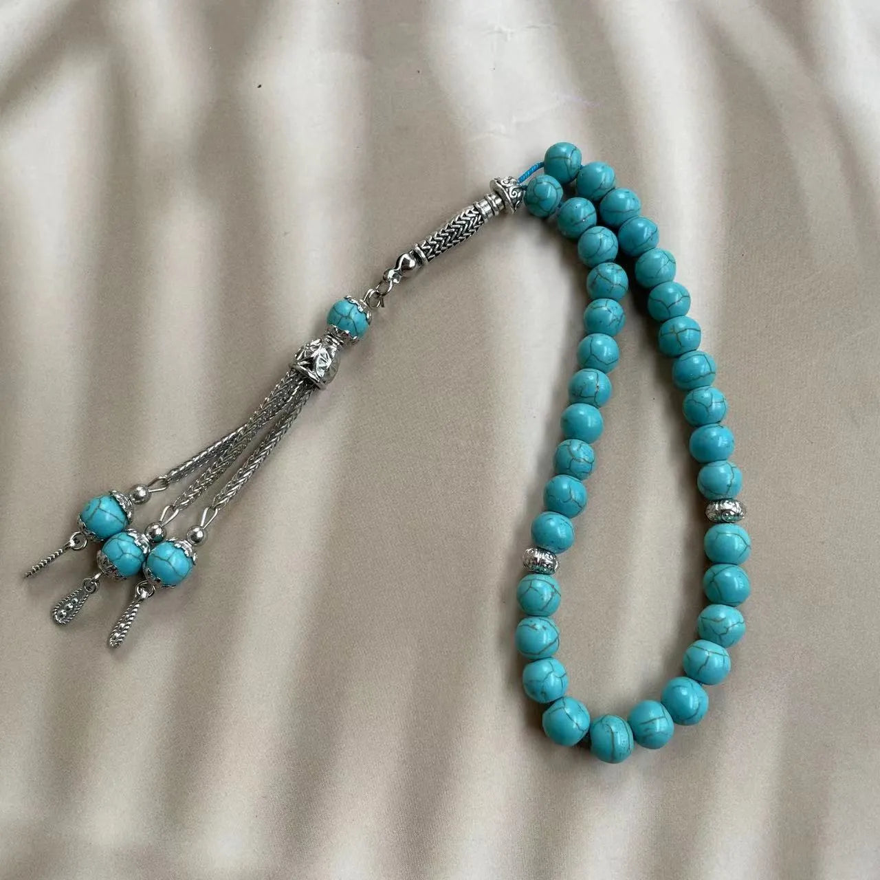 Handmade sky blue stone bead Muslim prayer bracelet for daily worship and dhikr counting.