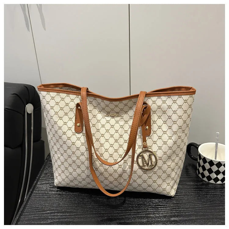 Women's western style PU leather shoulder bag in black showing visible sewing thread details.