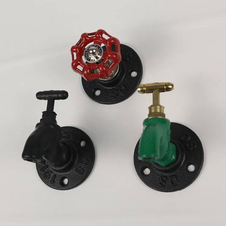 Water pipe style metal wall hook for towels on a white wall, shown in black, green, and red colour options.