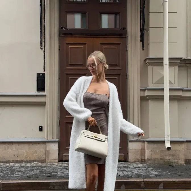 White long sleeve knit cardigan jacket on a hanger