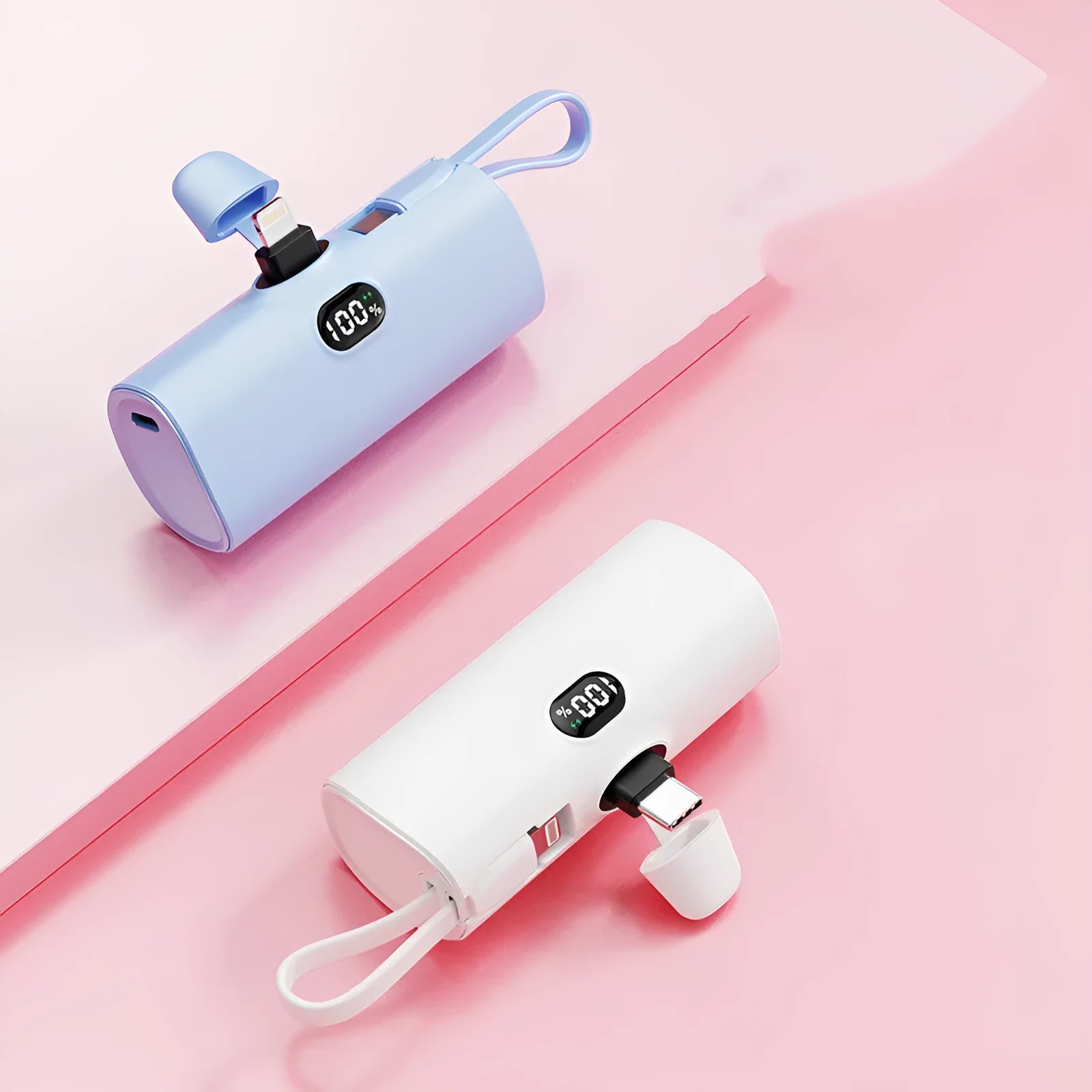 Compact capsule-shaped wireless power bank with a UK plug and digital display, shown in pink.