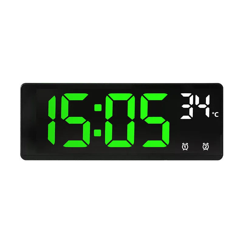 Electronic alarm clock with large LED screen showing time and temperature on desktop