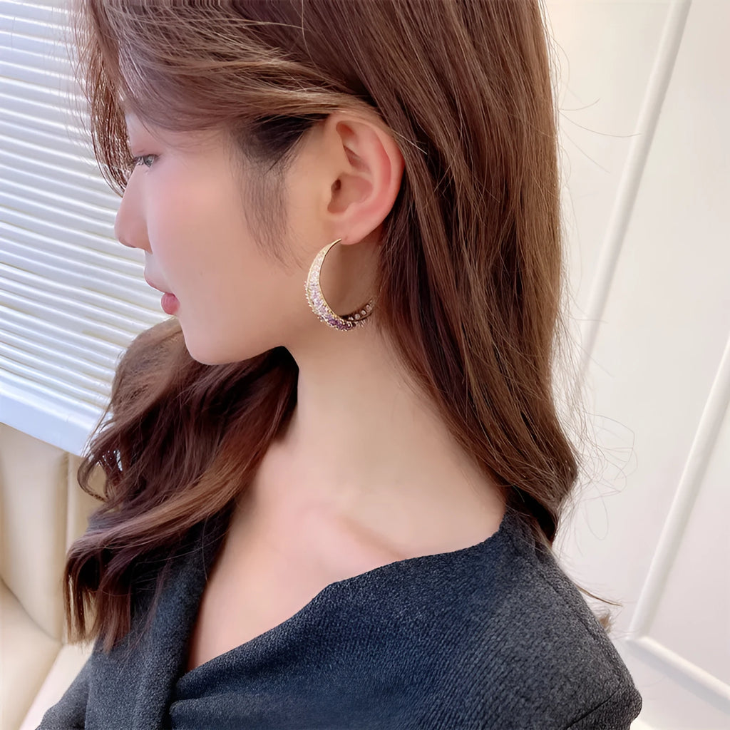 Women's large geometric copper hoop earrings in gold, silver, purple, green, or black.