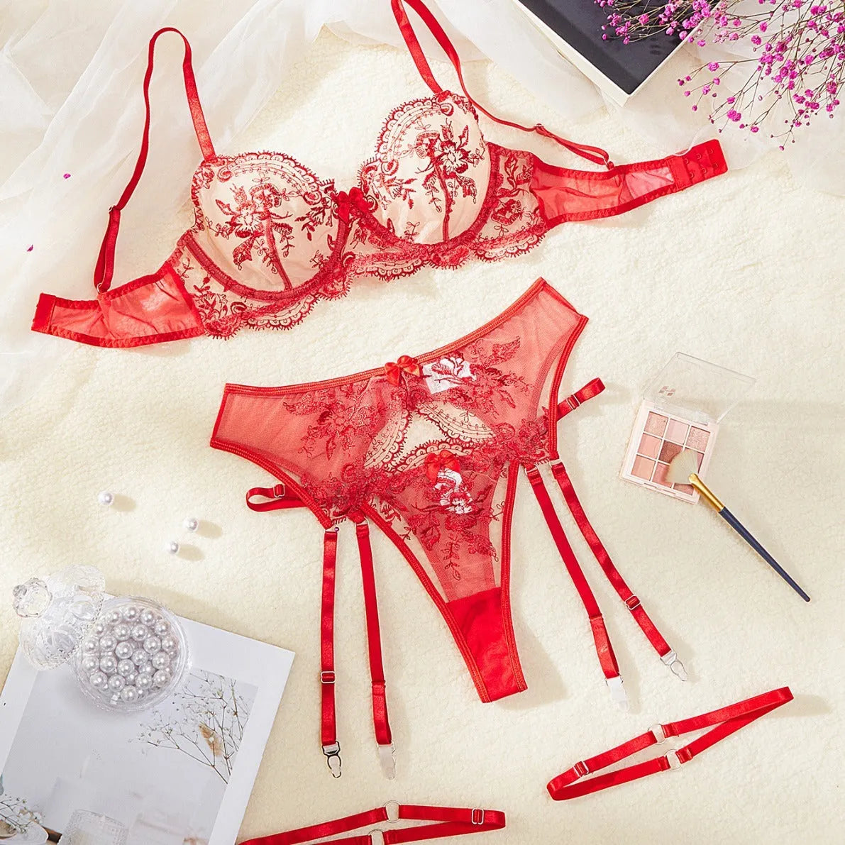 Women's embroidered see-through cutout lingerie set with garters in sapphire blue