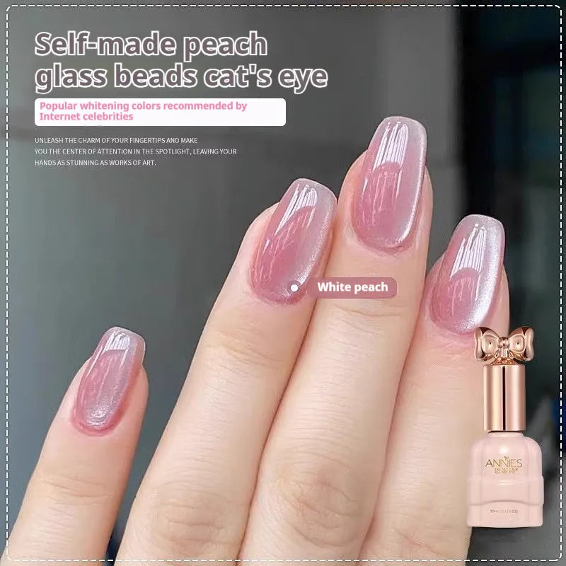 Micro glass bead cat's eye gel nail polish bottle showing cat's eye visual effect