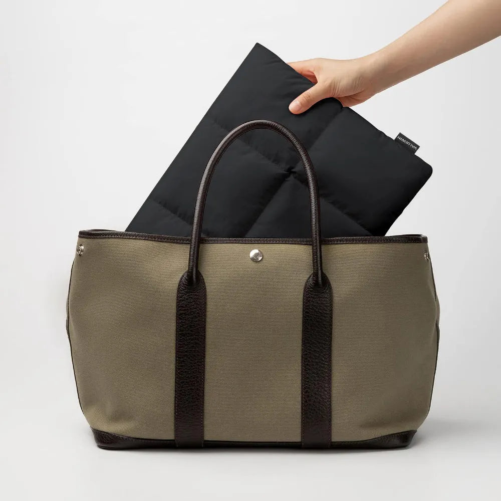 Soft fluffy laptop sleeve in black and khaki colours for 13-15.6 inch laptops with sewing thread detail