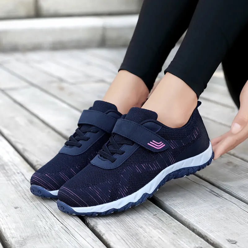 Women's low-top grey purple wedge heel casual shoes with velcro strap on soft mesh upper.
