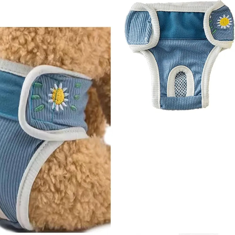 Reusable washable dog physiological pants in blue with cartoon print on a white background