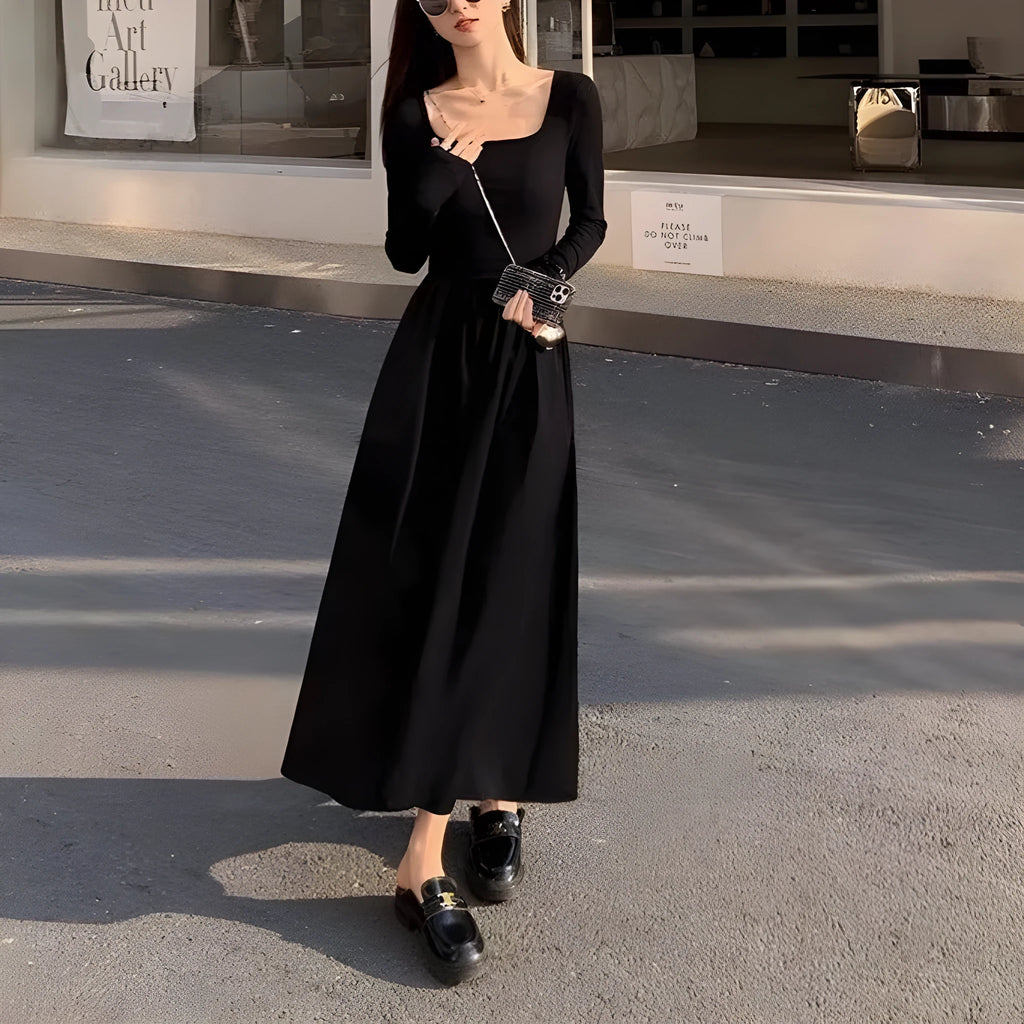 Women's black knitted square collar A-line dress with long sleeves and an elastic waist.