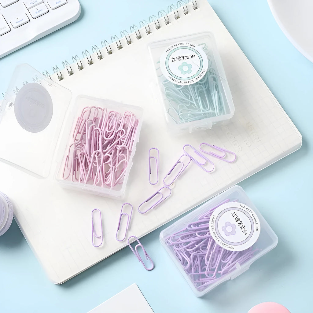 Set of macaron colour alloy paper clips in pink, green, and purple, showing 28mm and 50mm sizes, on a light background