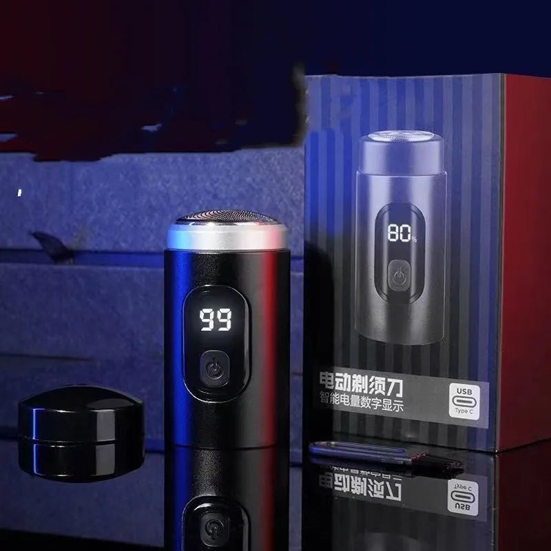Black portable rechargeable shaver with USB cable and cleaning brush on a white background.