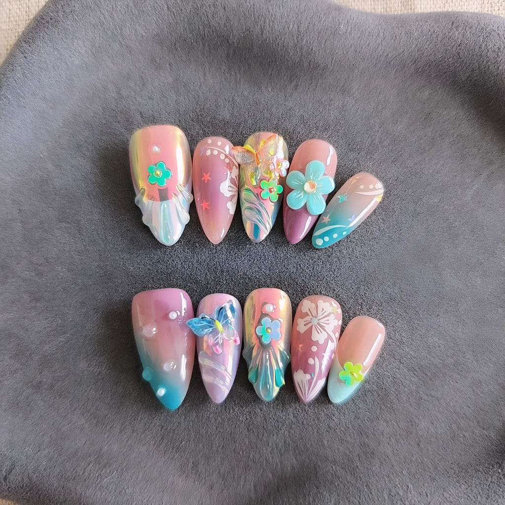 Handmade colourful nail art set with embossed small flower and butterfly sculptures for almond-shaped manicures.