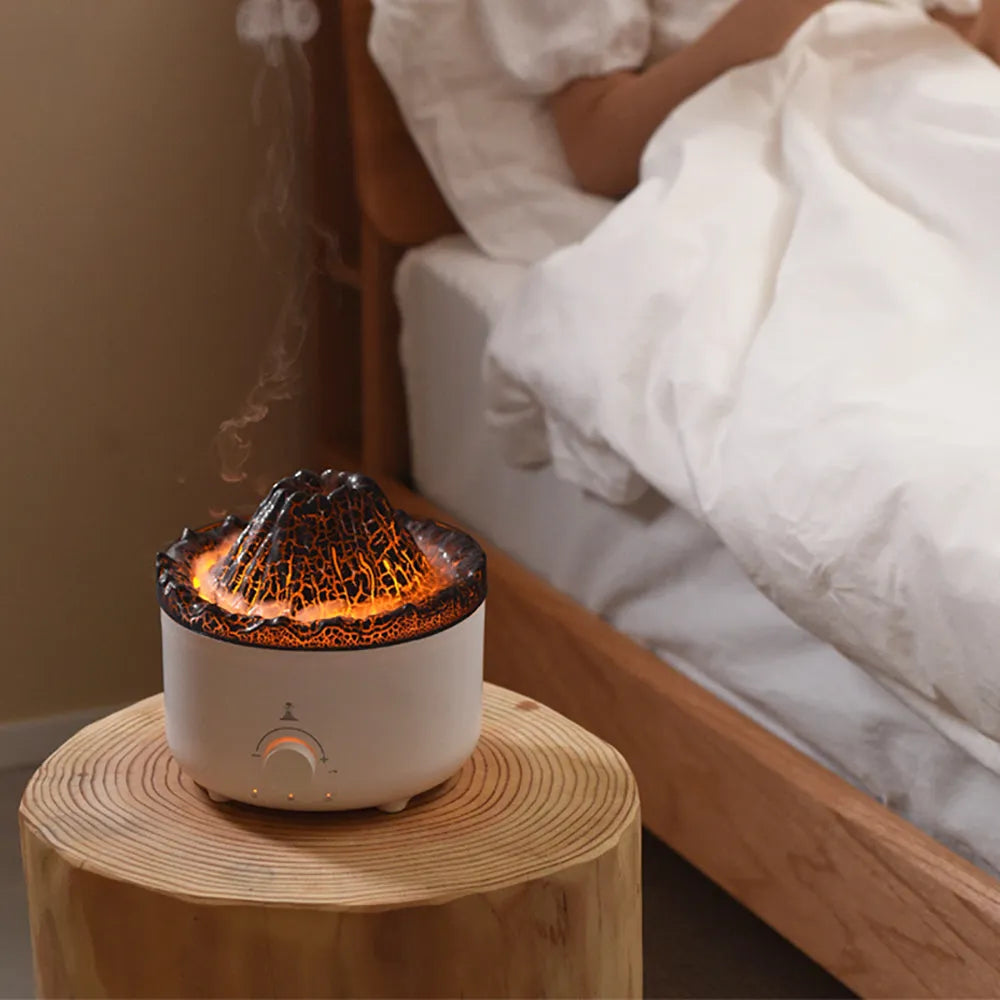 White volcano-shaped humidifier and essential oil diffuser with orange and blue simulated flame light effect.