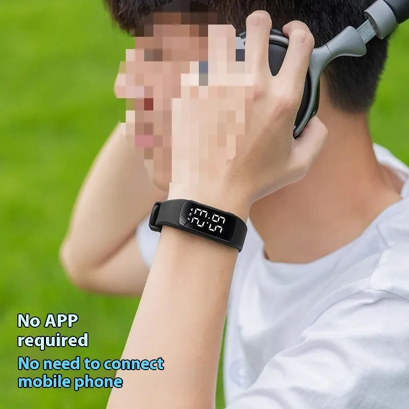 Vibration alarm smart watch with coloured silicone strap on a wrist, showing LED display.