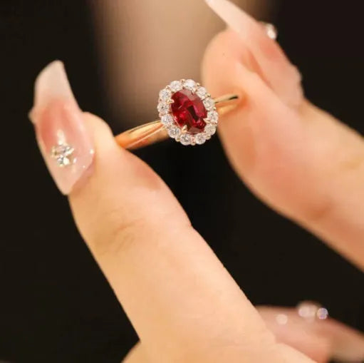 Gold pigeon blood ruby sterling silver ring with floral design and artificial gemstone centre
