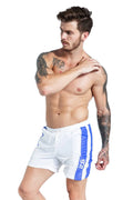 Men's blue lace-up sports shorts with padding on a white background.
