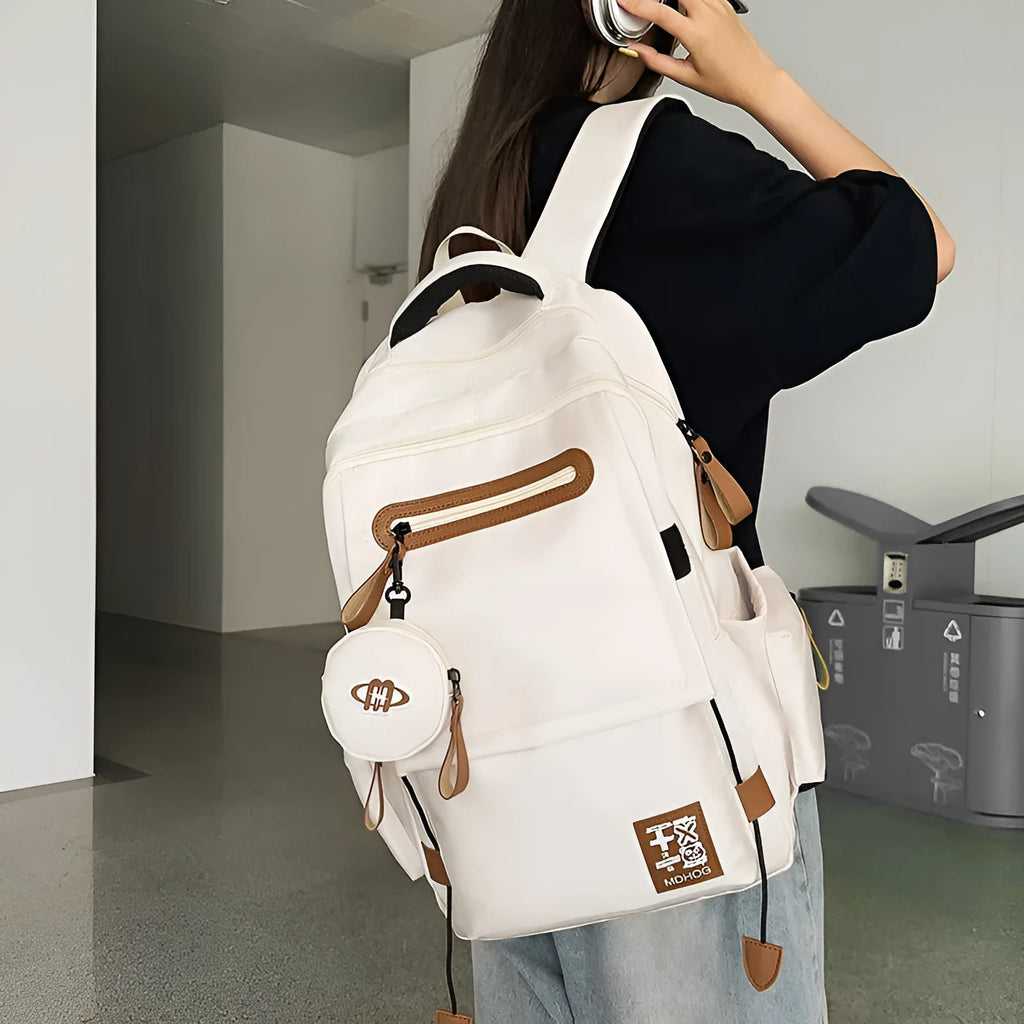 Japanese leisure travel backpack in black with contrast stitching and 20-35 litre capacity