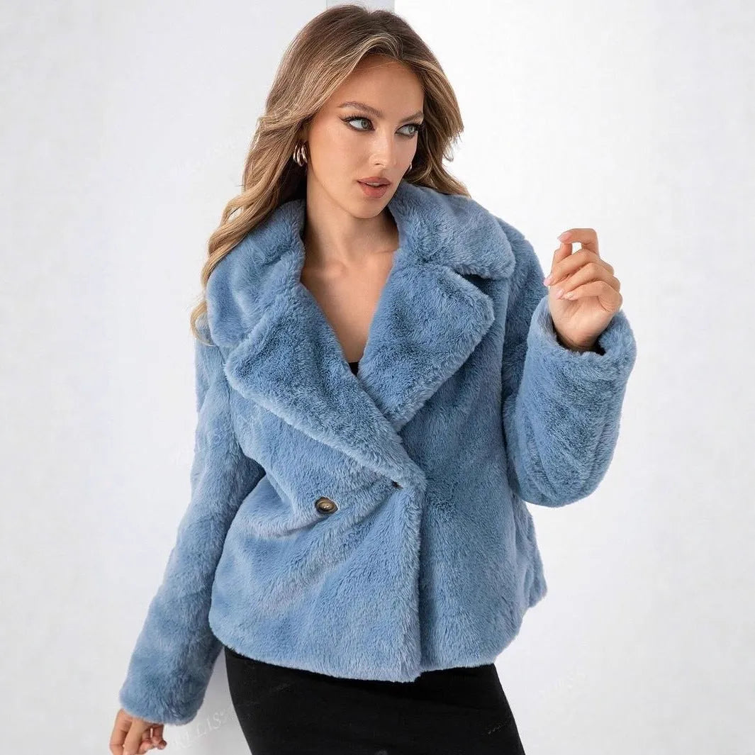 Women's loose short faux fur coat in rose red on a hanger, showing regular sleeves and textured fabric.