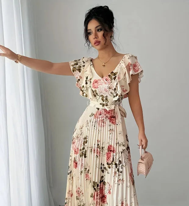 Apricot floral print women's dress with v-neck, ruffled short sleeves, and a high-waisted pleated swing skirt.