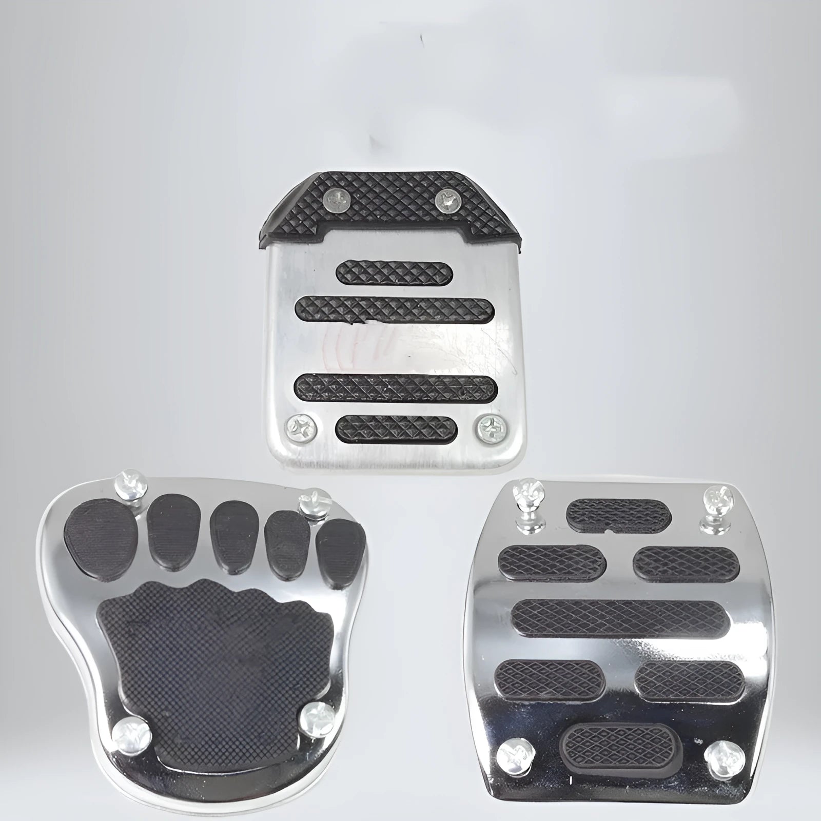 Metal motorcycle brake pedal skid plate showing three style variations for different vehicle types