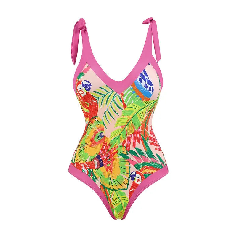 Retro pink floral print one-piece swimsuit with V-neck, skirt, and backless design.