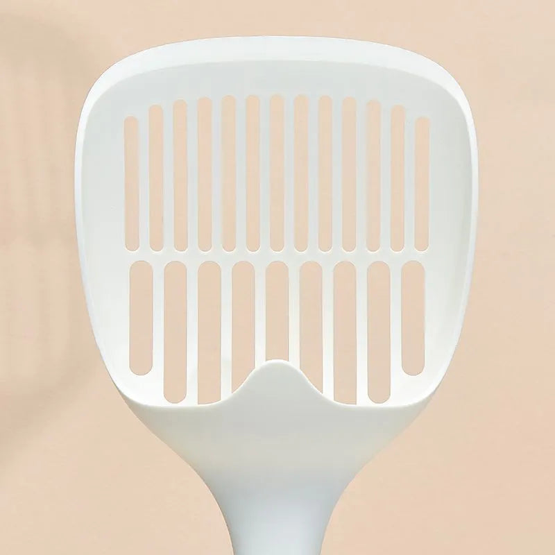White plastic cat litter scoop with attached storage base on a white background.