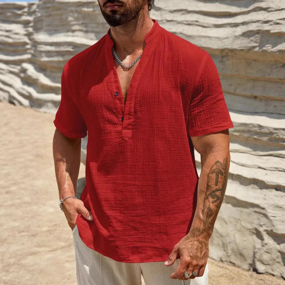 Man wearing a light blue stand collar short-sleeved casual shirt for summer.