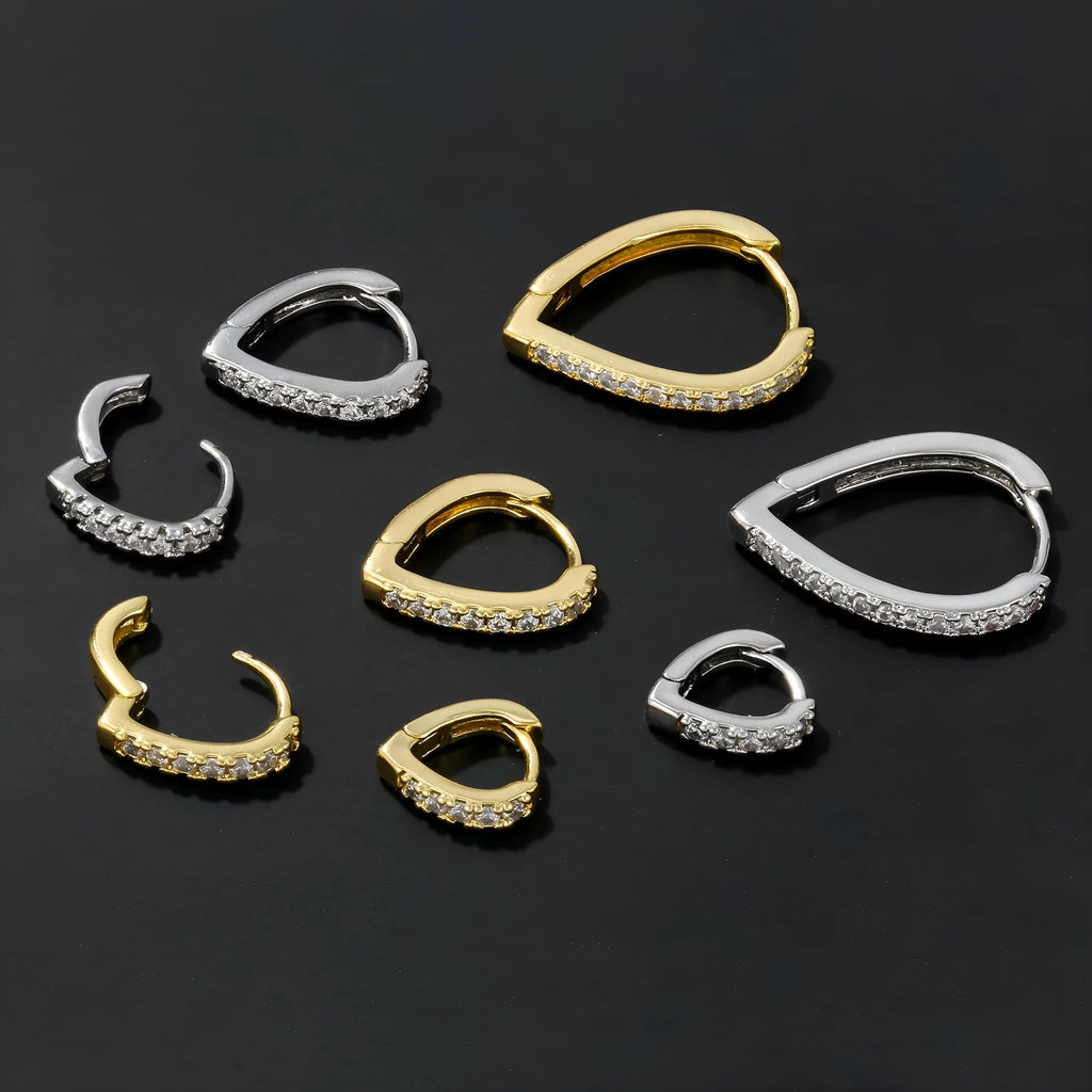 Geometric heart-shaped copper ear clip with electroplated gold finish for women.