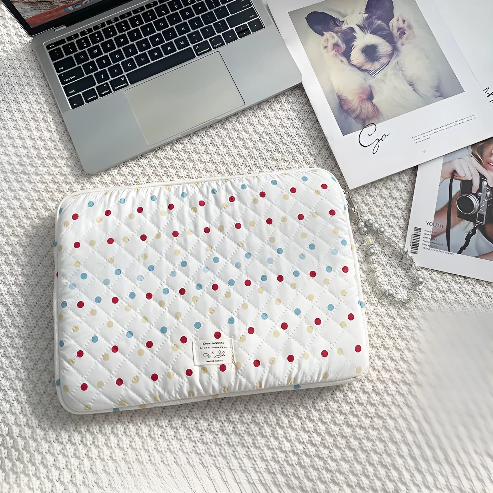 Women's polka dot polyester laptop bag shown in solid colour with size options for 11-inch to 15.6-inch laptops.
