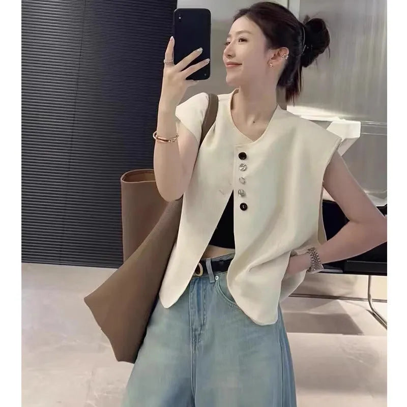 Women's loose-fit short polyester vest in milky white with a pocket, shown on a hanger.