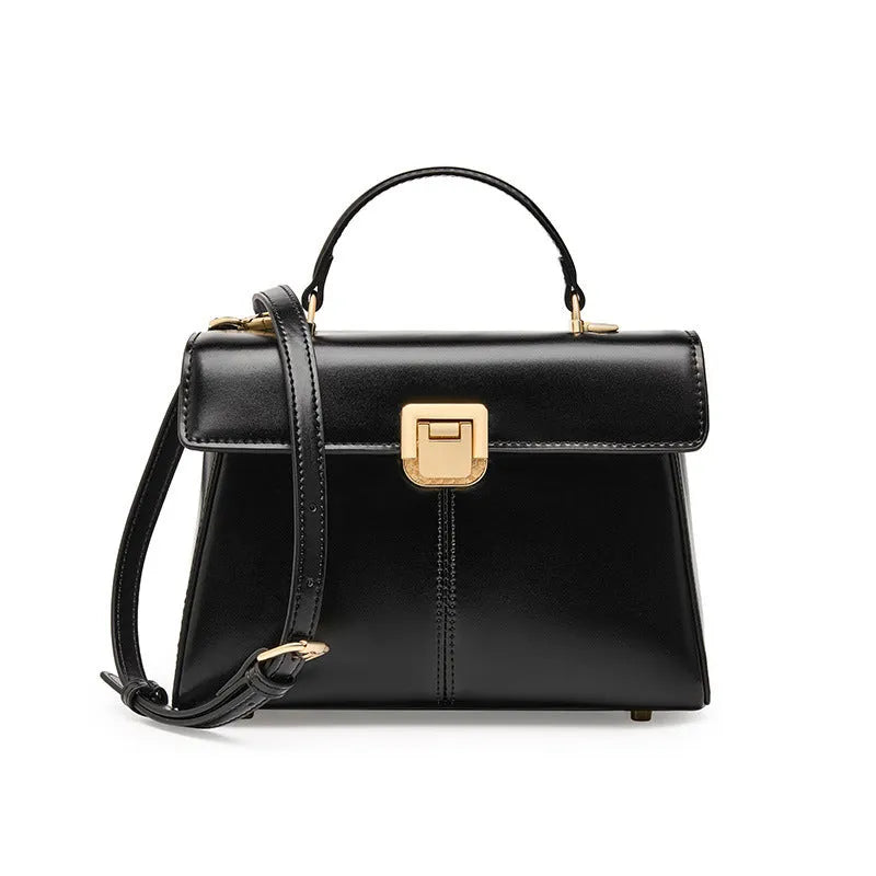Black genuine leather women's shoulder bag with a vachette clasp, shown open to reveal a zippered hidden pocket.