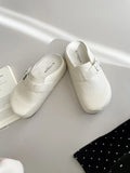 Flat round-toe casual sneakers with a metal buckle on the PU upper.