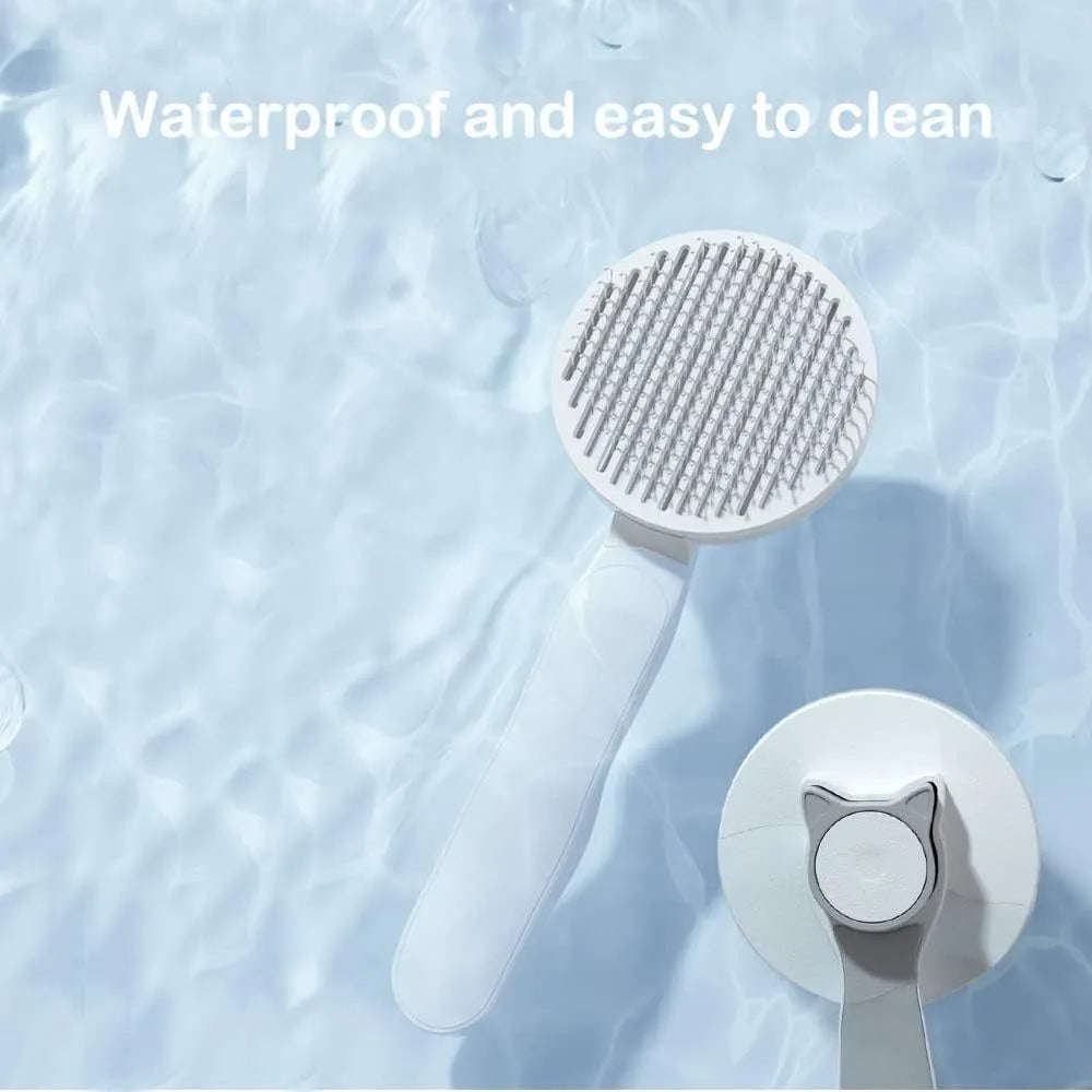 Self-cleaning cat brush with blue handle and rubber-tipped metal pins