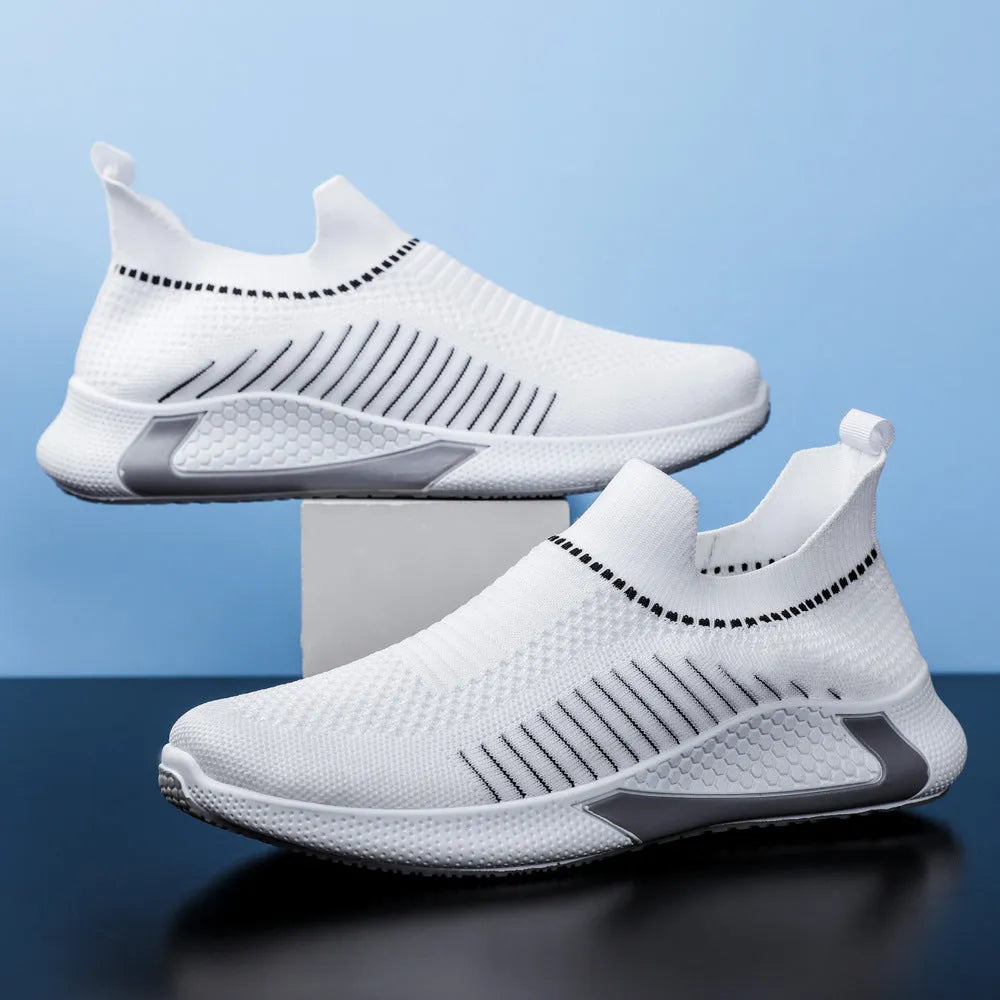 Men's black and white striped mesh sock sneakers with lace-up front and round toe.