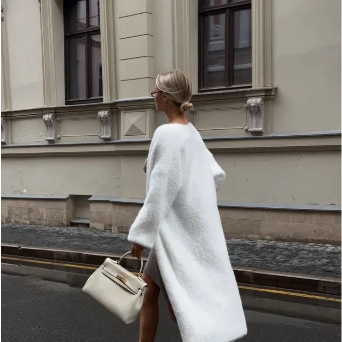White long sleeve knit cardigan jacket on a hanger
