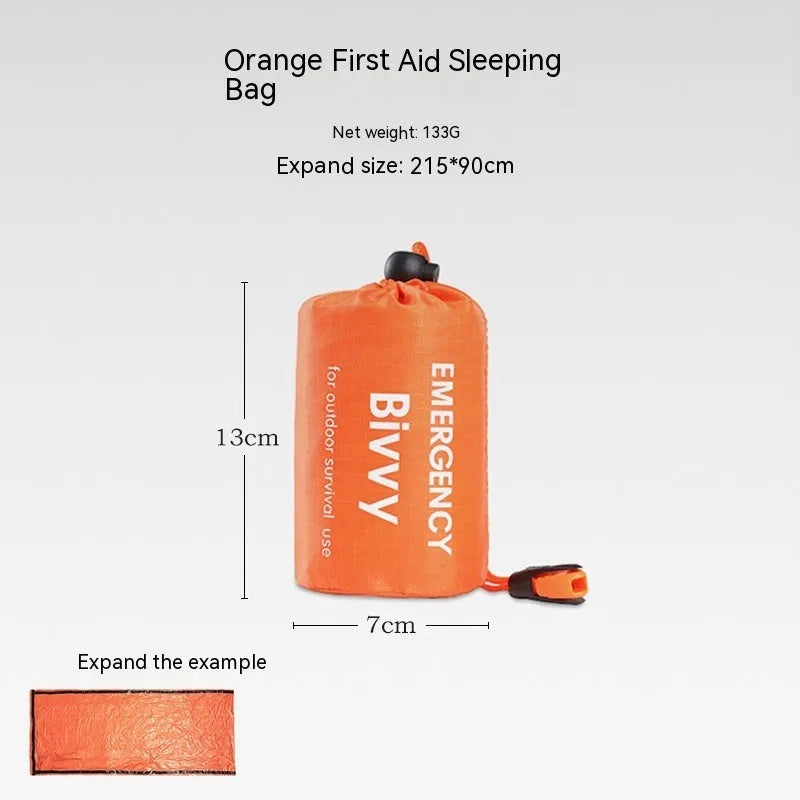 Orange and green emergency tent, sleeping bag, and raincoat kit for outdoor survival.