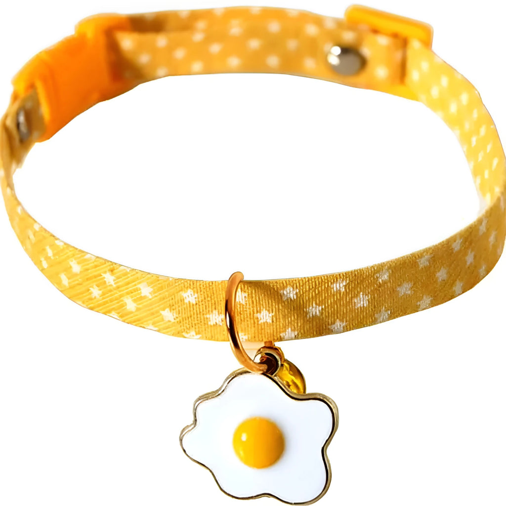 Adjustable green cat collar with a metal bell pendant and a matching bow tie decoration.